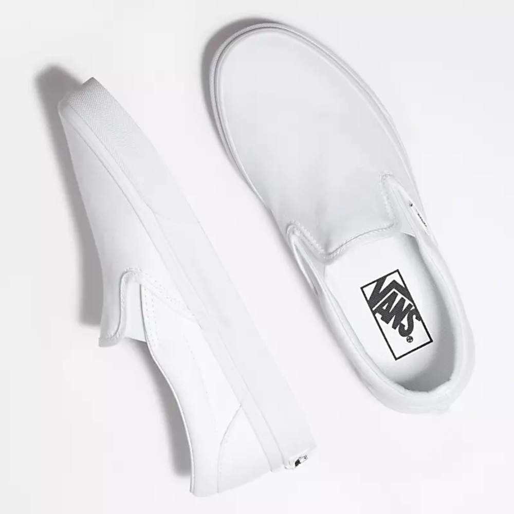 Brand new white slip on Vans size 7 in womens!!